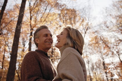 Couple Dancing Under Fall Trees